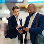 A medical concierge professional assisting a patient with their medical travel checklist, simplifying the logistics of their journey.