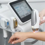 Close-up of modern laser hair removal equipment showing different handpieces for various wavelengths.