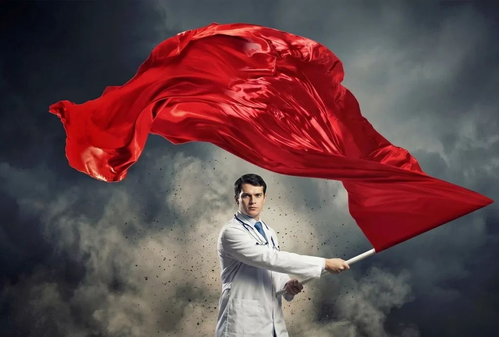 A determined male doctor in a white coat and stethoscope firmly holds a massive, billowing satin red flag against a dark, turbulent stormy sky background with swirling dust.