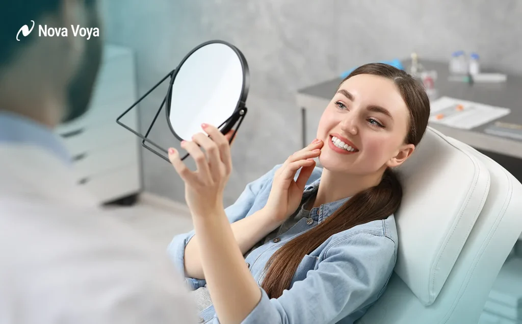 A confident woman with a perfect Hollywood smile in front of the Dubai skyline, representing high-quality aesthetic and cosmetic dentistry.